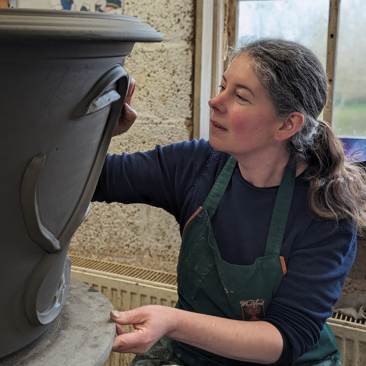 Caroline decorating flowerpot